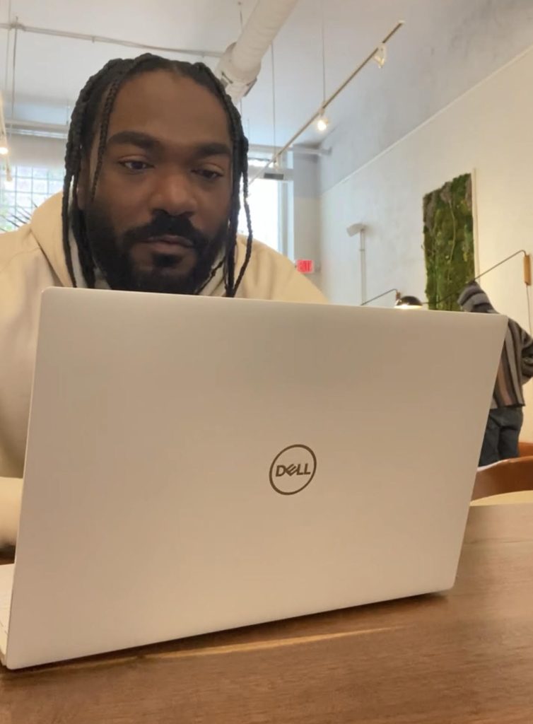 Man working on Dell laptop