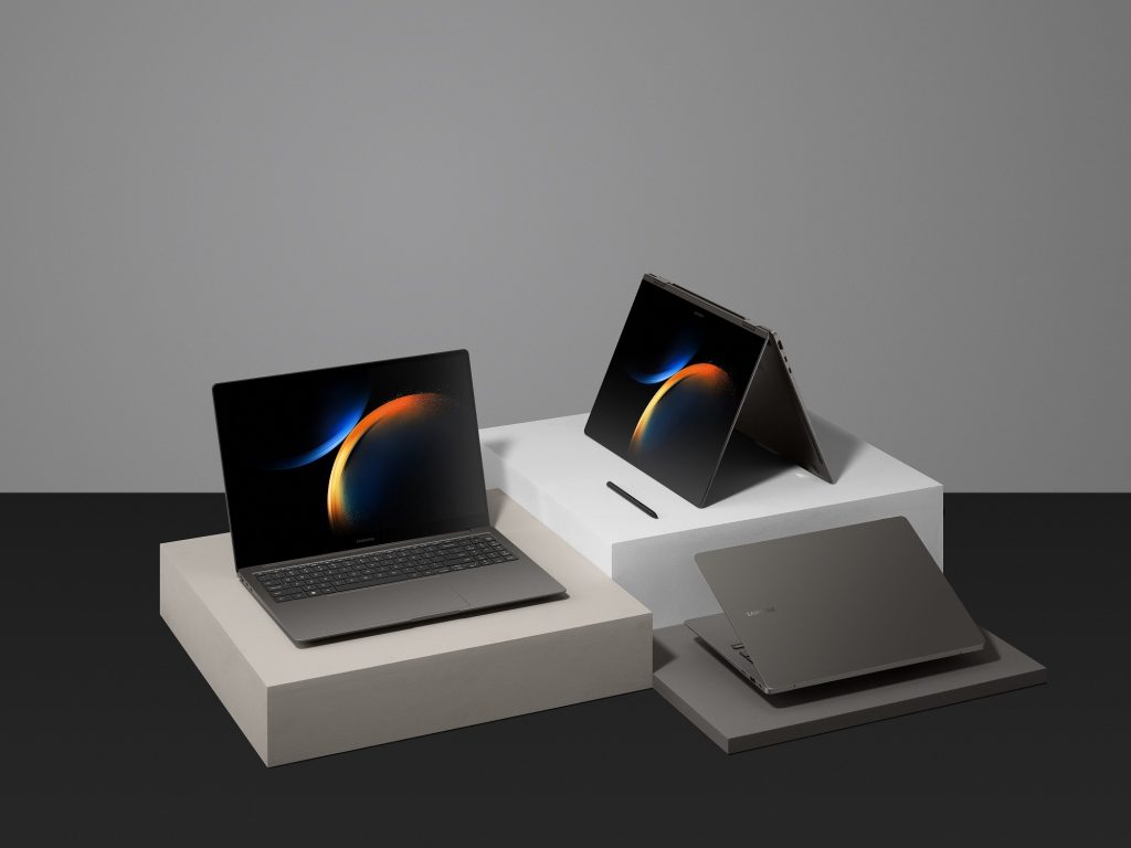 Three laptops open in different modes on three pedestals